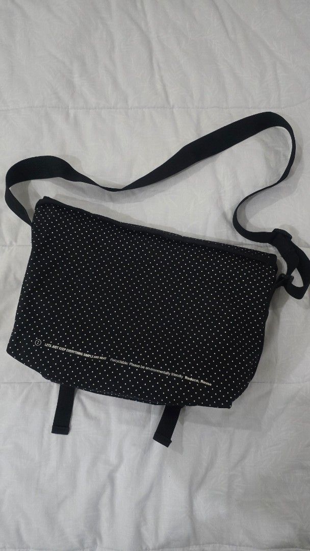 Chocoolate Messenger Bag (Category: Sling Bags) located in Cainta. Submitted by masnes (Listing ID 1442580132, Image 2). Description: - Stylish black tote bag with playful white polka dots. - Features the 'CHOCOLATE' logo in white. - Adjustable straps with secure buckle closures. - Includes an inspiring message: 'Lets just keep everything simple and neat. Recyclable. Please be environmentally friendly. Reduce, Reuse'. - Ideal size for your daily 