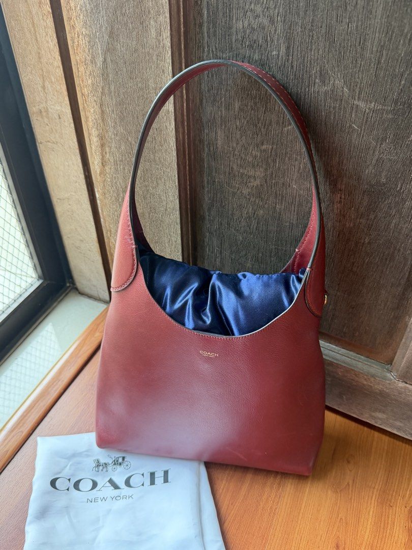 Coach Brooklyn 28 Burgundy (Category: Luxury Bags & Wallets) located in Las Pinas. Submitted by blt.declutter (Listing ID 1441237657, Image 2). Description: - 101% authentic! u can do unli-checks - Comes with original dust bag - minimal signa of use + i lost the coach charm lang na nakahang supposedly on the side :") rfs: eyeing a different coach bag.