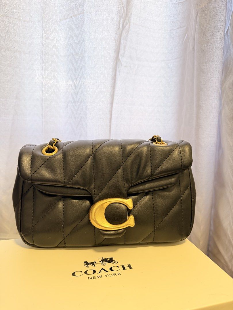 Coach Pillow Tabby Shoulder Bag 18 Black (Category: Luxury Bags & Wallets) located in Manila. Submitted by migeyaa (Listing ID 1442727789, Image 2). Description: - Black quilted leather shoulder bag - Iconic gold C logo hardware - Stylish chain strap detail - Comes with original box and dust bag - Versatile for day or night use.