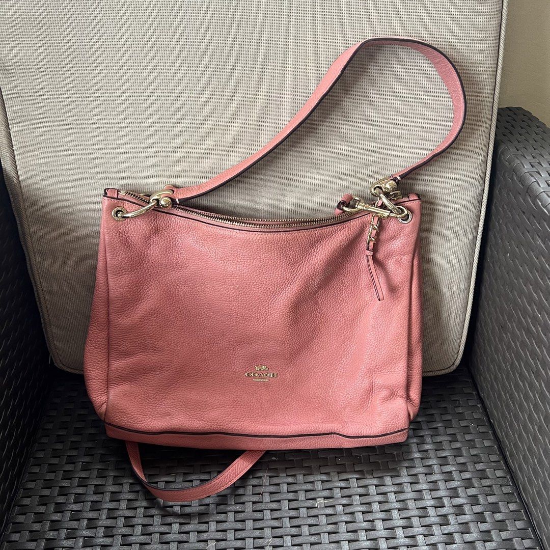 Coach Pink Pebbled Leather Shoulder Bag (Category: Luxury Bags & Wallets) located in Tagbilaran City. Submitted by riesdeclutters (Listing ID 1442687445, Image 1). Description: Coach pebbled leather shoulder bag in a lovely pink shade. Has a zip top closure and an adjustable strap. Interior has a few pockets. Gold hardware details. Great everyday bag. Minor flaw: rubs on corners only.