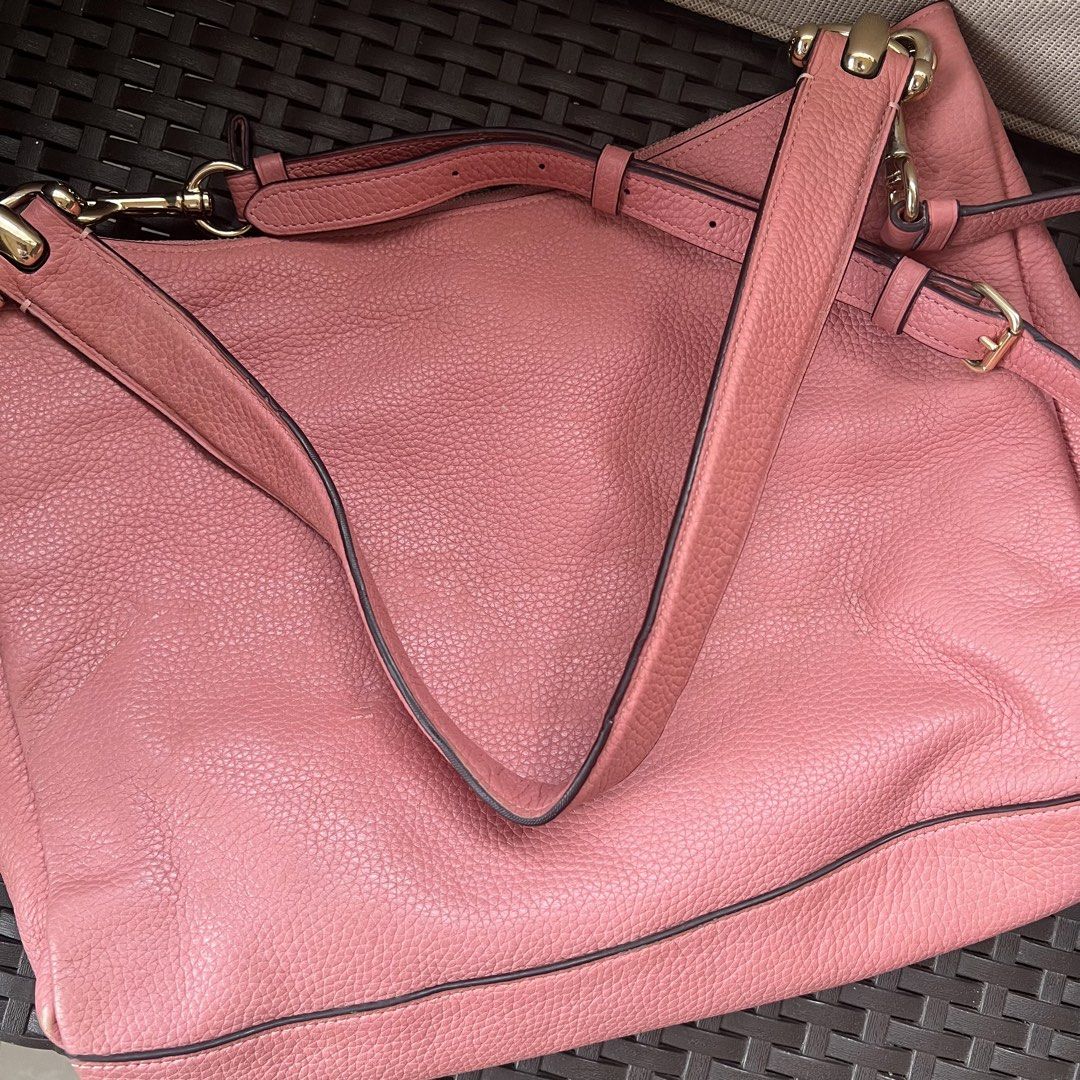 Coach Pink Pebbled Leather Shoulder Bag (Category: Luxury Bags & Wallets) located in Tagbilaran City. Submitted by riesdeclutters (Listing ID 1442687445, Image 3). Description: Coach pebbled leather shoulder bag in a lovely pink shade. Has a zip top closure and an adjustable strap. Interior has a few pockets. Gold hardware details. Great everyday bag. Minor flaw: rubs on corners only.