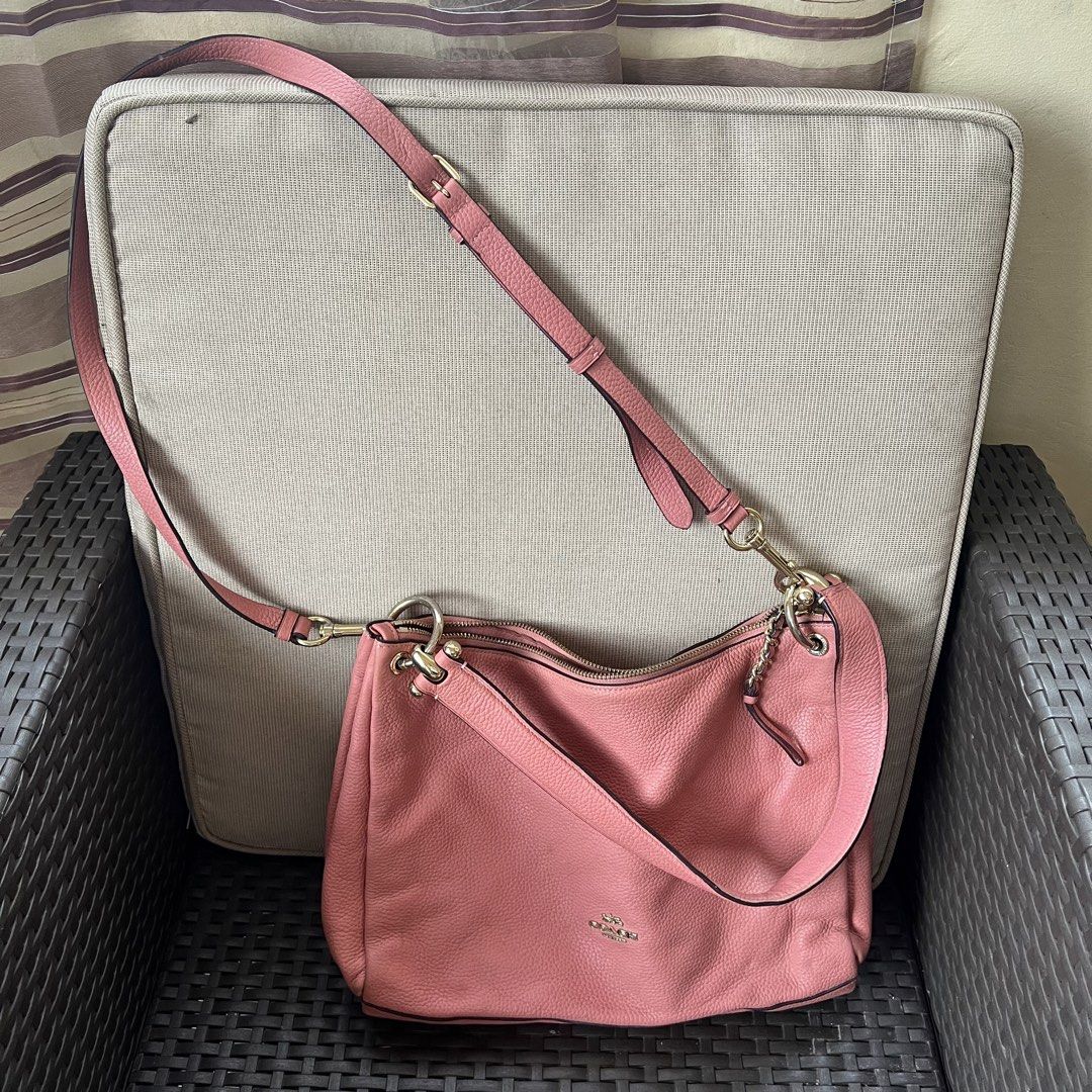 Coach Pink Pebbled Leather Shoulder Bag (Category: Luxury Bags & Wallets) located in Tagbilaran City. Submitted by riesdeclutters (Listing ID 1442687445, Image 2). Description: Coach pebbled leather shoulder bag in a lovely pink shade. Has a zip top closure and an adjustable strap. Interior has a few pockets. Gold hardware details. Great everyday bag. Minor flaw: rubs on corners only.