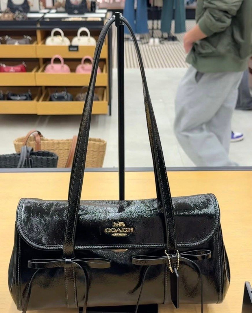Coach Signature Shoulder Bag (Category: Shoulder Bags) located in Caloocan City. Submitted by brandeditemsph (Listing ID 1442680010, Image 3). Description: - Authentic Coach shoulder bag - Features iconic signature C print - Secure flap closure - Comfortable single strap - Includes a stylish leather tag - Available colors: Brown/Gold, Blue Denim, Black Patent, Beige Patent - Ideal for everyday use.