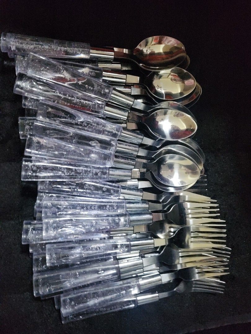 Coca-Cola clear bubble Stainless Steel Spoon and Fork set (Category: Dinnerware & Cutlery) located in Pasig City. Submitted by js.authenticlux (Listing ID 1442550001, Image 2). Description: - Set of spoons and forks - Clear acrylic handles with Coca-Cola branding inside - Made of durable stainless steel - Perfect for parties, everyday meals, or as a collector's item - Generous number of pieces included for great value - 200 per set - call txt 091