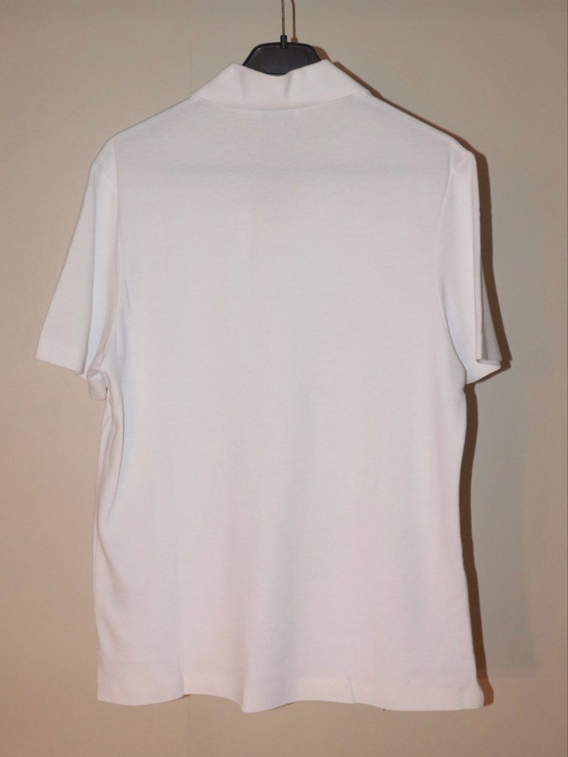 COS White Short Sleeve Collared Polo Shirt (Category: Tshirts & Polo Shirts ) located in Manila. Submitted by ar_archives (Listing ID 1442711296, Image 2). Description: - White COS polo shirt - Size XS - Short sleeves with collared neckline - Made from a textured fabric - Simple and classic design - Ideal for casual wear or layering - BRAND NEW, NEVER WORN.