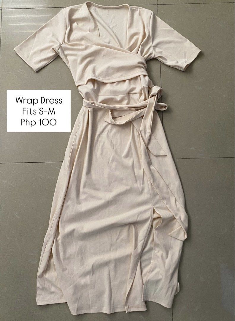 Cream Wrap Dress Fits S-M (Category: Dresses) located in Imus. Submitted by theninetiesboxph (Listing ID 1442592789, Image 1). Description: - Chic cream wrap dress - Features a flattering tie waist - Stylish side slit detail - Versatile fit for sizes S-M - Ideal for both casual outings and dressing up - Effortless to style for any occasion.