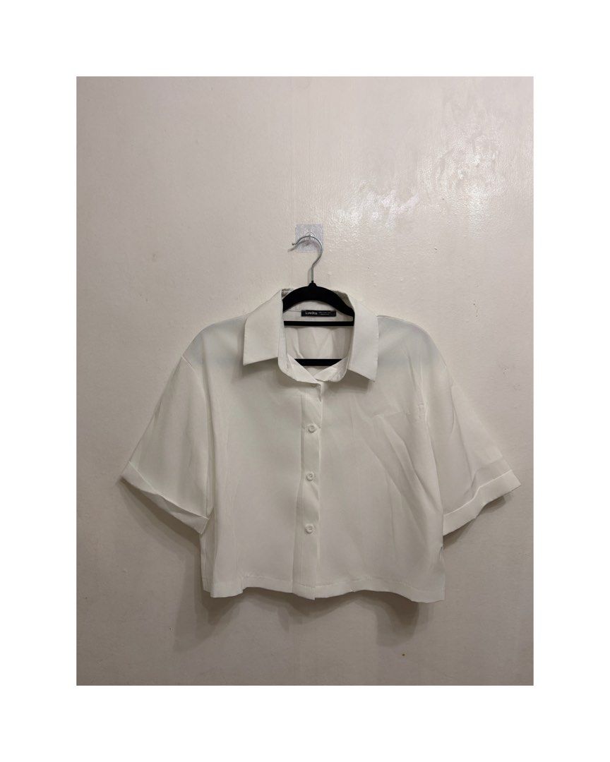 Crop White Blouse (Category: Blouses) located in Caloocan City. Submitted by mrynn_declutter (Listing ID 1442716948, Image 1). Description: .