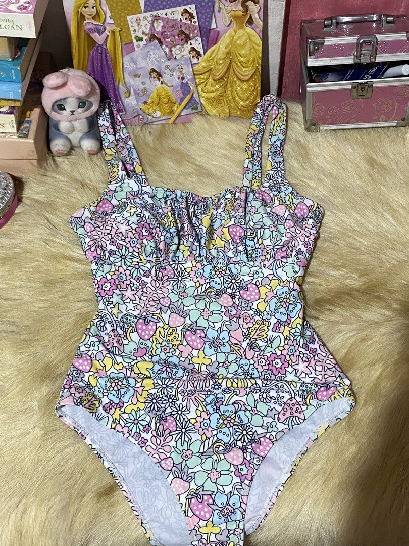 Cute Floral One-Piece Swimsuit Whimsy (Category: Bikinis & Swimsuits) located in Mexico. Submitted by timitum (Listing ID 1442703961, Image 1). Description: - Adorable one-piece swimsuit - Fun, colorful floral and strawberry print - Ruched bust detail - Adjustable straps - Perfect for beach days or pool parties - Super cute and unique design Never been used.