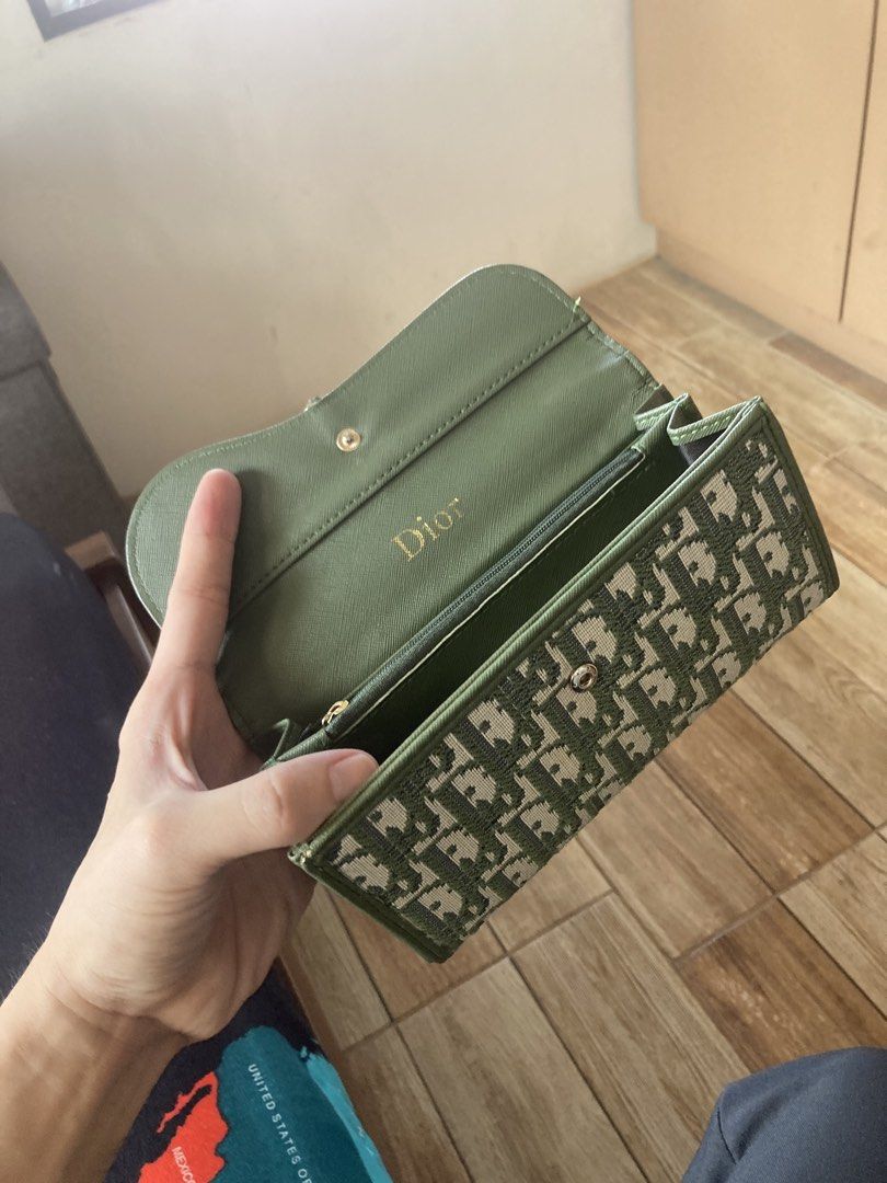 Dior Monogram Wallet Green (Category: Luxury Bags & Wallets) located in Paranaque City. Submitted by southside.watchco (Listing ID 1442714449, Image 1). Description: - Authentic Dior monogram wallet - Classic green canvas exterior - Luxurious green leather interior - Ample card slots for organization - Secure zippered compartment - Elegant gold hardware detail - Stylish and practical for everyday use.