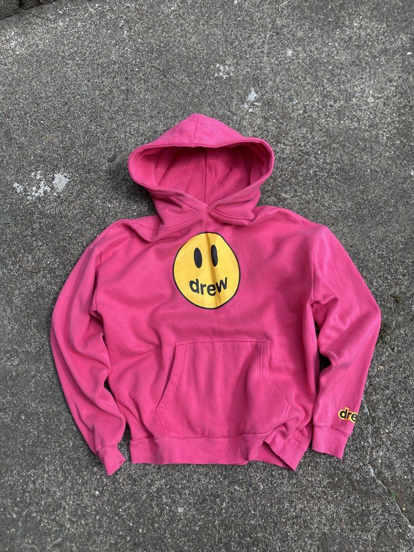 Drew House Pink hoodie (Category: Hoodies) located in Batangas. Submitted by arries_thirft (Listing ID 1442600233, Image 1). Description: - Authentic Pink Drew House Hoodie - Iconic smiley face logo on front - Small Drew logo on sleeve cuff - Size: Large (L) - Comfortable and stylish for everyday wear - Perfect for casual outfits 1500 plus sf Batangas location .