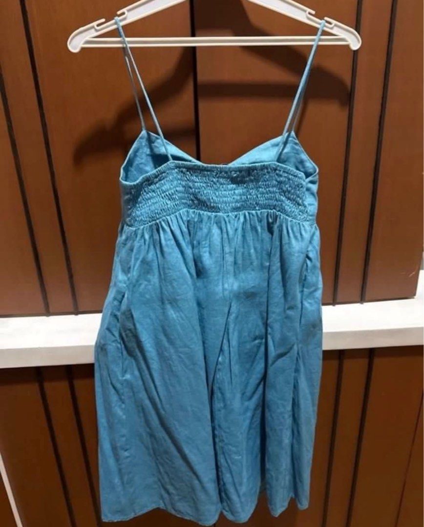 Editor’s Market Mini Dress (Category: Dresses) located in Manila. Submitted by declutters137 (Listing ID 1442599014, Image 2). Description: - Adorable blue mini dress - Features delicate spaghetti straps - Flattering ruched detail on the bust - Comfortable smocked back for a perfect fit - Estimated size: Small to Medium - Versatile for casual outings or a night on the town.