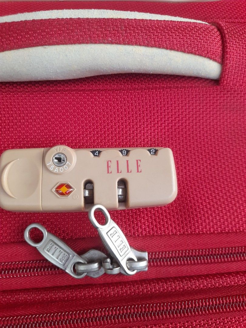 Elle Red Rolling Suitcase Luggage with TSA Lock (Category: Luggage) located in Valenzuela. Submitted by newbear.425b6e (Listing ID 1442608296, Image 3). Description: - Vibrant red Elle suitcase, perfect for travel. - Features a built-in TSA lock for security. - Smooth-rolling wheels for easy maneuverability. - Telescopic handle extends for comfortable handling. - Interior straps keep your belongings securely in place. - Spacious interior offers p