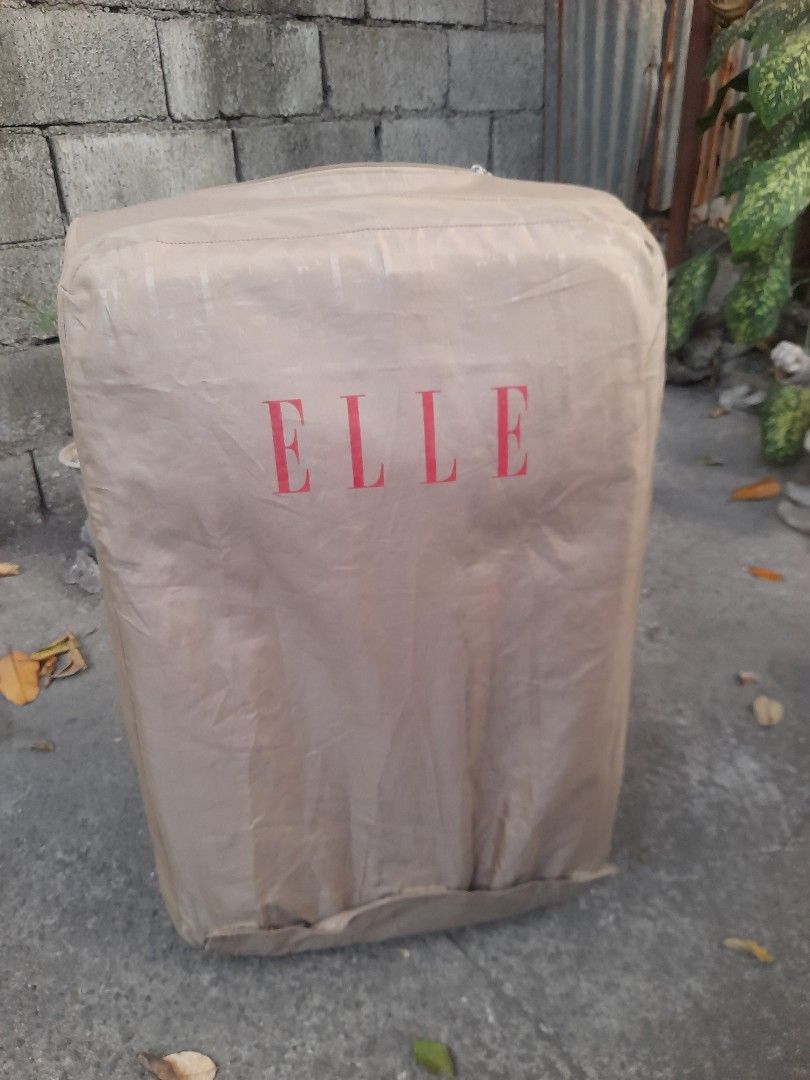 Elle Red Rolling Suitcase Luggage with TSA Lock (Category: Luggage) located in Valenzuela. Submitted by newbear.425b6e (Listing ID 1442608296, Image 1). Description: - Vibrant red Elle suitcase, perfect for travel. - Features a built-in TSA lock for security. - Smooth-rolling wheels for easy maneuverability. - Telescopic handle extends for comfortable handling. - Interior straps keep your belongings securely in place. - Spacious interior offers p