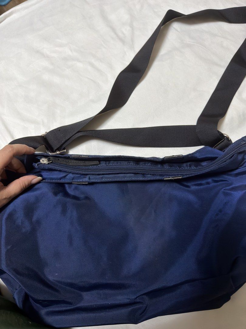 Esprit Navy Blue Nylon Crossbody Bag (Category: Cross-body Bags) located in Muntinlupa City. Submitted by kiarraaa (Listing ID 1442546500, Image 3). Description: - Navy blue Esprit crossbody bag - Made of durable nylon material - Main zippered compartment - Inner zippered pocket - Adjustable strap for comfortable wear - Short Handle removed.