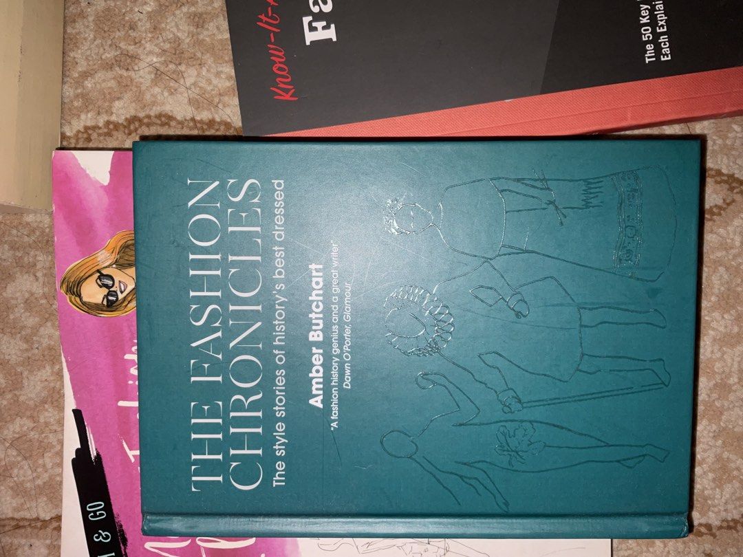 Fashion books (Category: Storybooks) located in Manila. Submitted by aambur (Listing ID 1442702489, Image 1). Description: - Two fashion books perfect for enthusiasts. - 'Fashion Know-It-All': Covers 50 key fashion modes, garments, and designers. - 'The Fashion Chronicles' by Amber Butchart: Explores the histories of style. .