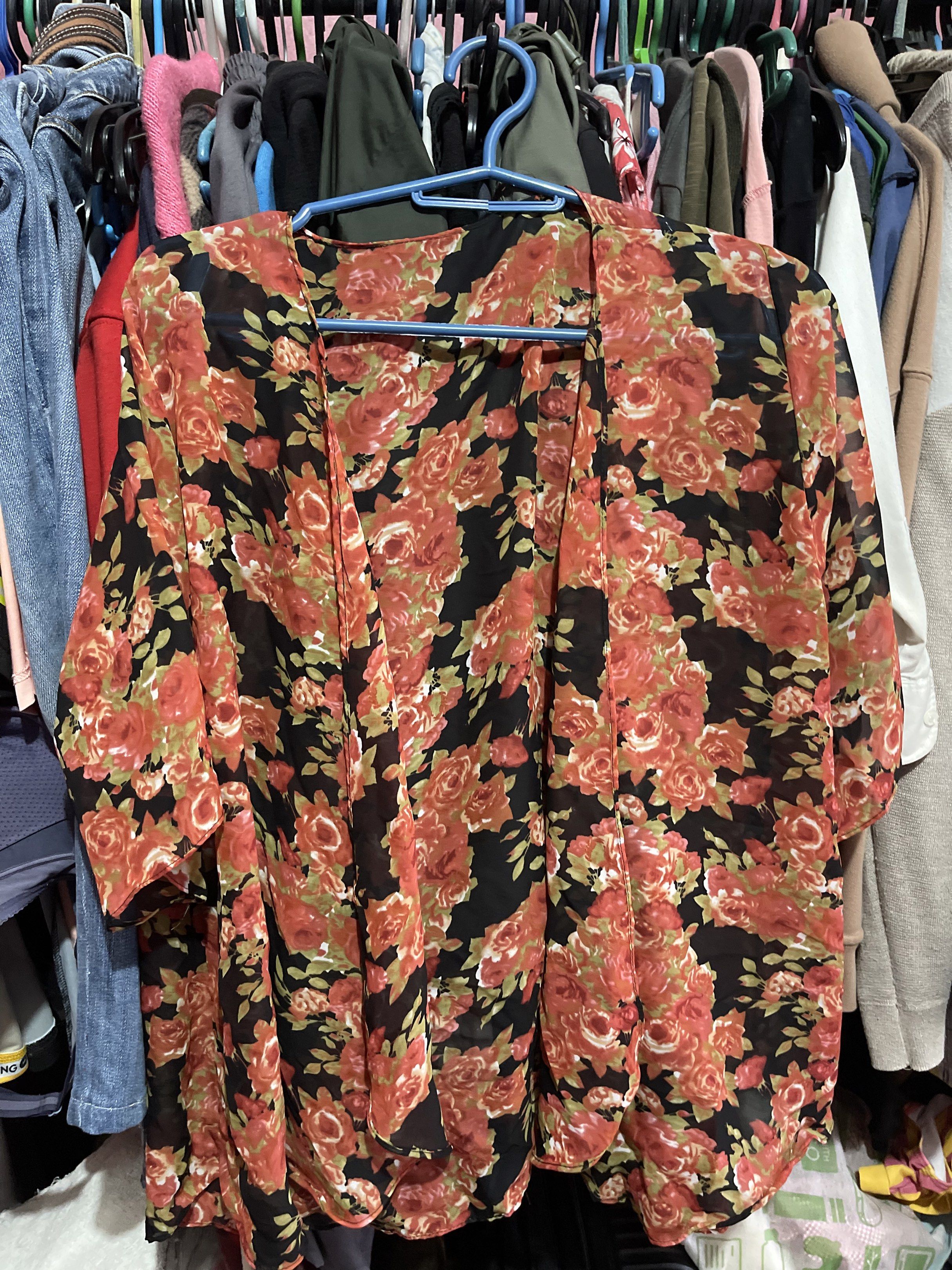 Floral Kimono Cardigan (Category: Coats, Jackets and Outerwear) located in Quezon City. Submitted by rish40 (Listing ID 1442640647, Image 1). Description: - Lightweight black kimono - Bold red and green floral print - Short sleeves - Open front design - Ideal for layering over tops or dresses - Adds a pop of color and style.