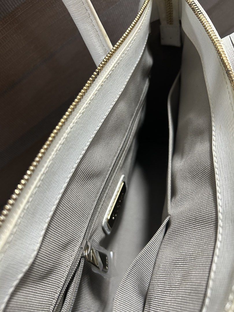 Furla Linda Medium Satchel Handbag (Category: Luxury Bags & Wallets) located in Angeles City. Submitted by zyeplustradings (Listing ID 1441927444, Image 3). Description: Furla Linda Medium Satchel Handbag a structured tote recognizable by its dual rolled handles, metallic gold logo lettering, and signature circular “F” logo charm hanging from the handle strap. Material: Crafted from durable, scratch-resistant Saffiano leather..