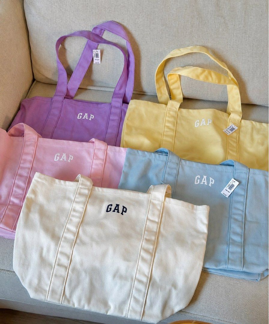 GAP Canvas Tote Bag - Pastel Colors (Category: Tote Bags) located in Taguig. Submitted by chillane (Listing ID 1442566158, Image 1). Description: - Cute GAP canvas tote bags - Available colors: Pastel Purple, Pink, Yellow, Light Blue, Cream - Features a simple GAP logo design - Ideal for everyday use, shopping, or carrying essentials - Made from durable canvas material.