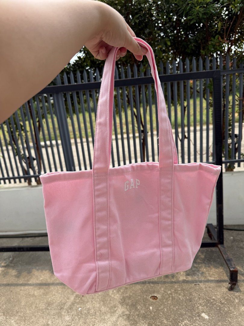 GAP Canvas Tote Bag - Pastel Colors (Category: Tote Bags) located in Taguig. Submitted by chillane (Listing ID 1442566158, Image 2). Description: - Cute GAP canvas tote bags - Available colors: Pastel Purple, Pink, Yellow, Light Blue, Cream - Features a simple GAP logo design - Ideal for everyday use, shopping, or carrying essentials - Made from durable canvas material.