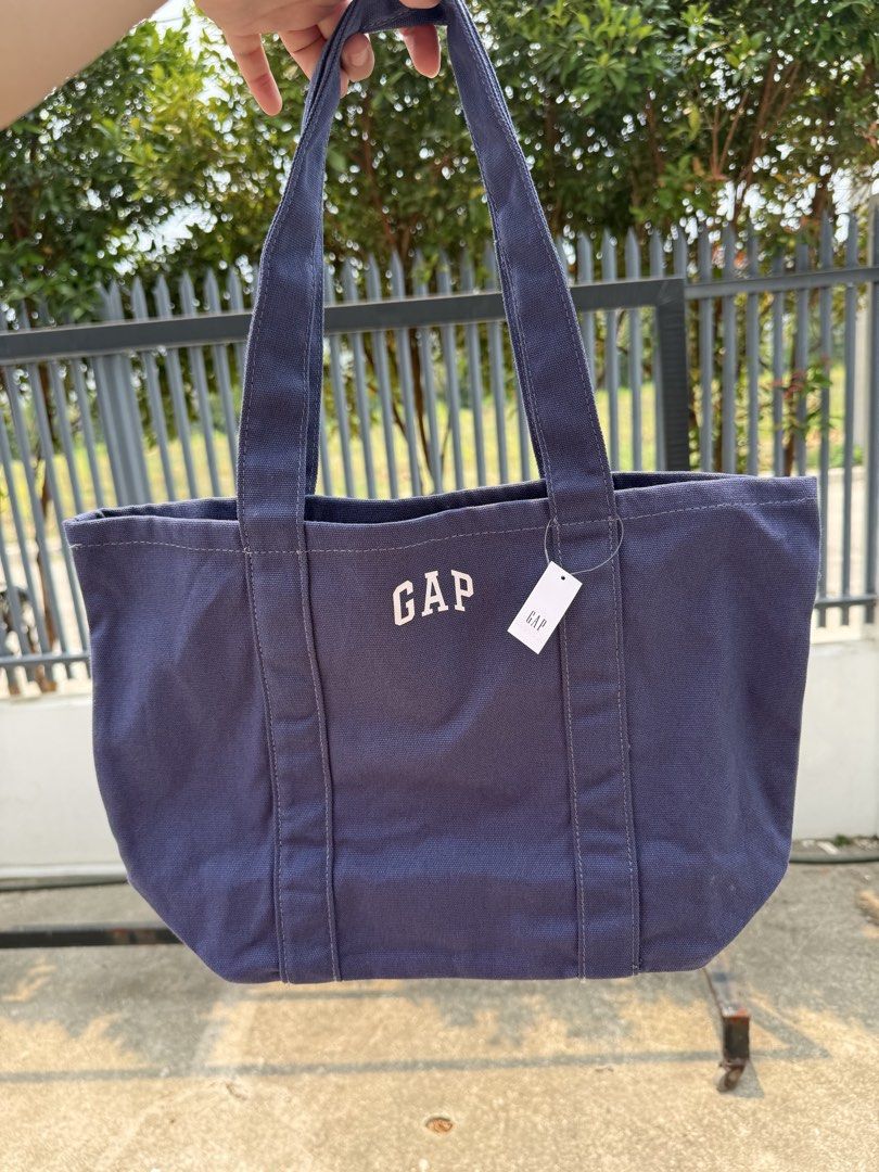 GAP Canvas Tote Bag - Pastel Colors (Category: Tote Bags) located in Taguig. Submitted by chillane (Listing ID 1442566158, Image 3). Description: - Cute GAP canvas tote bags - Available colors: Pastel Purple, Pink, Yellow, Light Blue, Cream - Features a simple GAP logo design - Ideal for everyday use, shopping, or carrying essentials - Made from durable canvas material.
