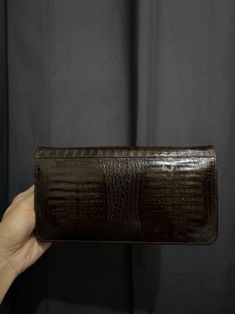 Genuine Double Crocodile Belly Clutch Bag (Category: Luxury Bags & Wallets) located in Munoz. Submitted by lolongs (Listing ID 1442722682, Image 1). Description: - Brown Genuine Crocodile crocskin bag - Excellent condition - Please see pictures for reference - Exotic reptile skin - Double Croc belly panels front and back - Super sosyal and elegante nito! Pwedeng pang event and date night. - Pwede nyong bilhan ng chain/strap since may Chain/Strap 
