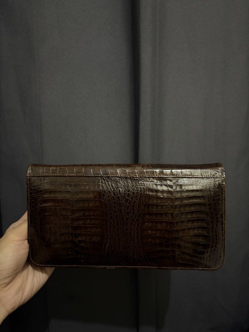 Genuine Double Crocodile Belly Clutch Bag (Category: Luxury Bags & Wallets) located in Munoz. Submitted by lolongs (Listing ID 1442722682, Image 2). Description: - Brown Genuine Crocodile crocskin bag - Excellent condition - Please see pictures for reference - Exotic reptile skin - Double Croc belly panels front and back - Super sosyal and elegante nito! Pwedeng pang event and date night. - Pwede nyong bilhan ng chain/strap since may Chain/Strap 