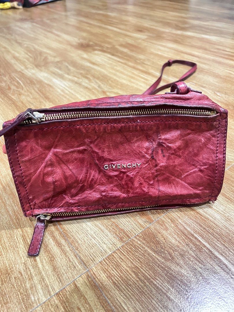 Givenchy Red Leather Wrinkled Crossbody Bag (Category: Luxury Bags & Wallets) located in Rizal. Submitted by ichaaay21 (Listing ID 1442656191, Image 3). Description: GIVENCHY RED PEPE LEATHER MINI PANDORA- Authentic Givenchy Crossbody Bag - Made in Italy - Color: Red - Material: Wrinkled Leather - Hardware: Gold - Features: Two zip compartments - Strap: Adjustable * slightly neg.