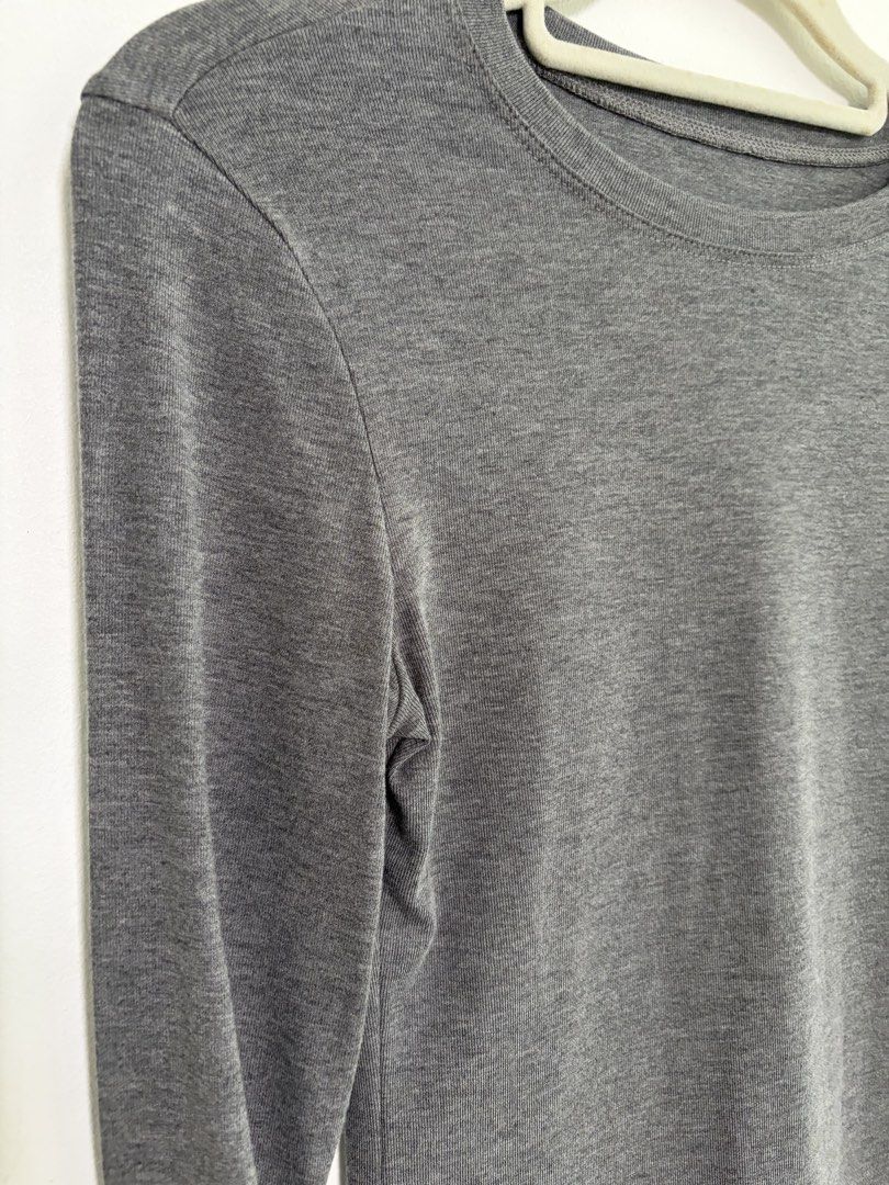 Gray basic long sleeve (Category: Longsleeves) located in Singapore. Submitted by 03043 (Listing ID 1442570273, Image 3). Description: -brand new( no flaws/defects/stains) -stretchy (size s-m can wear) -slightly body fitting, slimming effect -thin but durable material, great for hot weather,not see through -Easily paired with other clothing -great for layering.