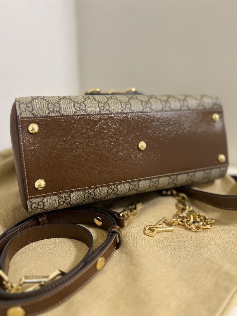 Gucci 1955 Horsebit Top-Handle in Brown (Category: Luxury Bags & Wallets) located in Manila. Submitted by katttdeclutters (Listing ID 1442625740, Image 3). Description: Japan sourced. Negotiable! Dustbag and two straps included. RFS: RUSH migrating • Width 29cm/ 11.4” • Height 20cm/ 7.9” • Depth 13cm/ 5.1”.