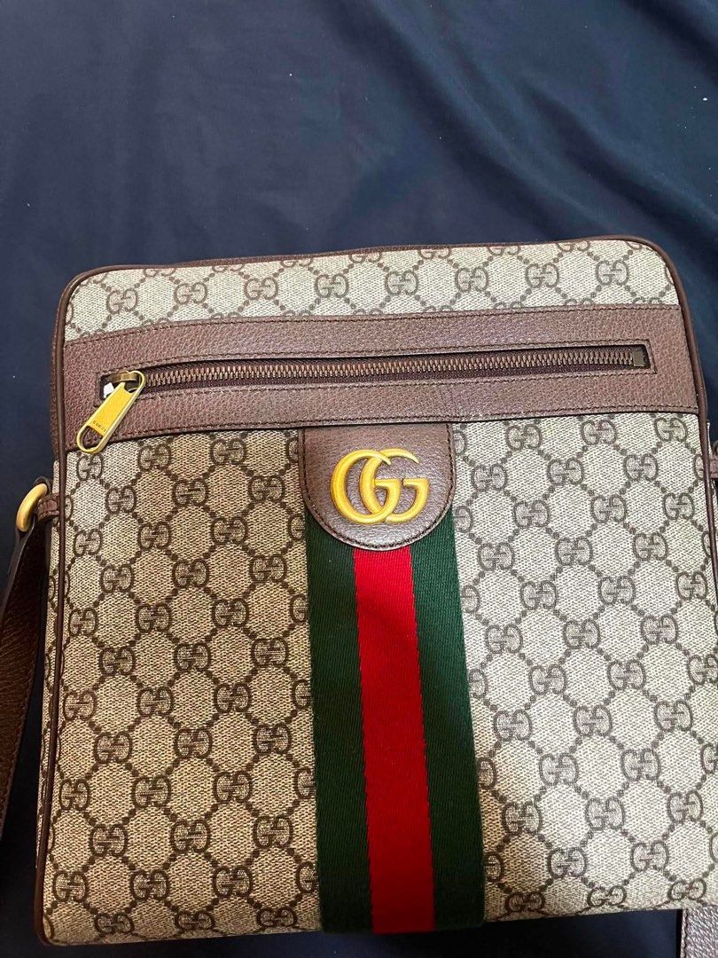 Gucci Ophidia GG Messenger Bag (Category: Luxury Bags & Wallets) located in Mandaluyong City. Submitted by kiko0304 (Listing ID 1442548132, Image 1). Description: Gucci Ophidia GG Messenger Bag in Beige and Ebony GG Supreme Canvas, featuring the iconic red and green Web stripe and antique gold-tone Double G hardware. Condition: • Pre-owned • Flaws are shown in the photos for full transparency • Overall well-maintained Inclusions: • Original Gucci