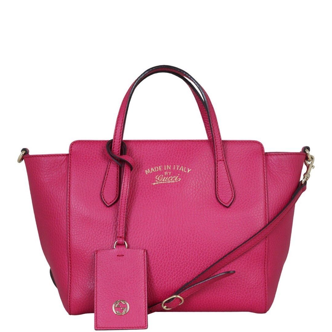 Gucci Pink Leather Top Handle Bag with Strap (Category: Luxury Bags & Wallets) located in Consolacion. Submitted by marjmier (Listing ID 1442620828, Image 1). Description: - Authentic Gucci handbag in vibrant pink - Made in Italy - Features top handles - Includes a detachable shoulder strap - Interior zippered pocket and slip pockets - Minor wear on handles and strap edges -Missing tag.