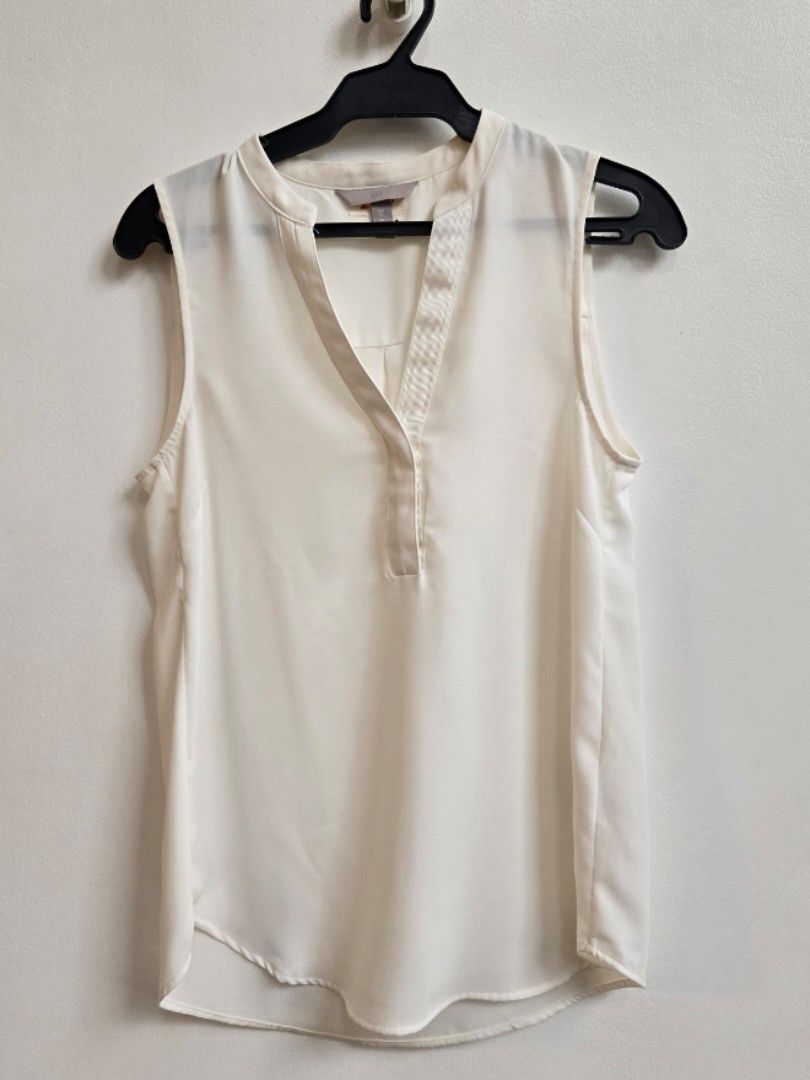 H&M White Sleeveless V-Neck Top (Category: Sleeveless) located in Paranaque City. Submitted by wasps_nest (Listing ID 1442550868, Image 1). Description: FREE when you get 3 items at regular price from my page - Lightweight fabric, perfect for layering or solo wear - Effortlessly dress up or down - Ready for pick up at Arcana Cafe PH, Cabuyao, Laguna (T-W-F-S,10:30AM - 6PM).