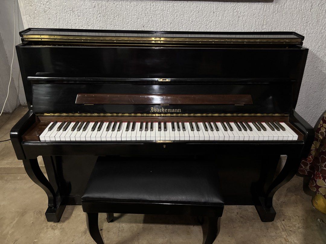Ibachemann Upright Piano with Bench (Category: Musical Instruments) located in Manila. Submitted by crhyne (Listing ID 1442698811, Image 2). Description: - Ibachemann upright piano - Classic black finish - Comes with matching bench - White and black keys - Shows some wear on the wood finish - Ideal for practice or beginner pianists - Requires tuning - Pick up only.