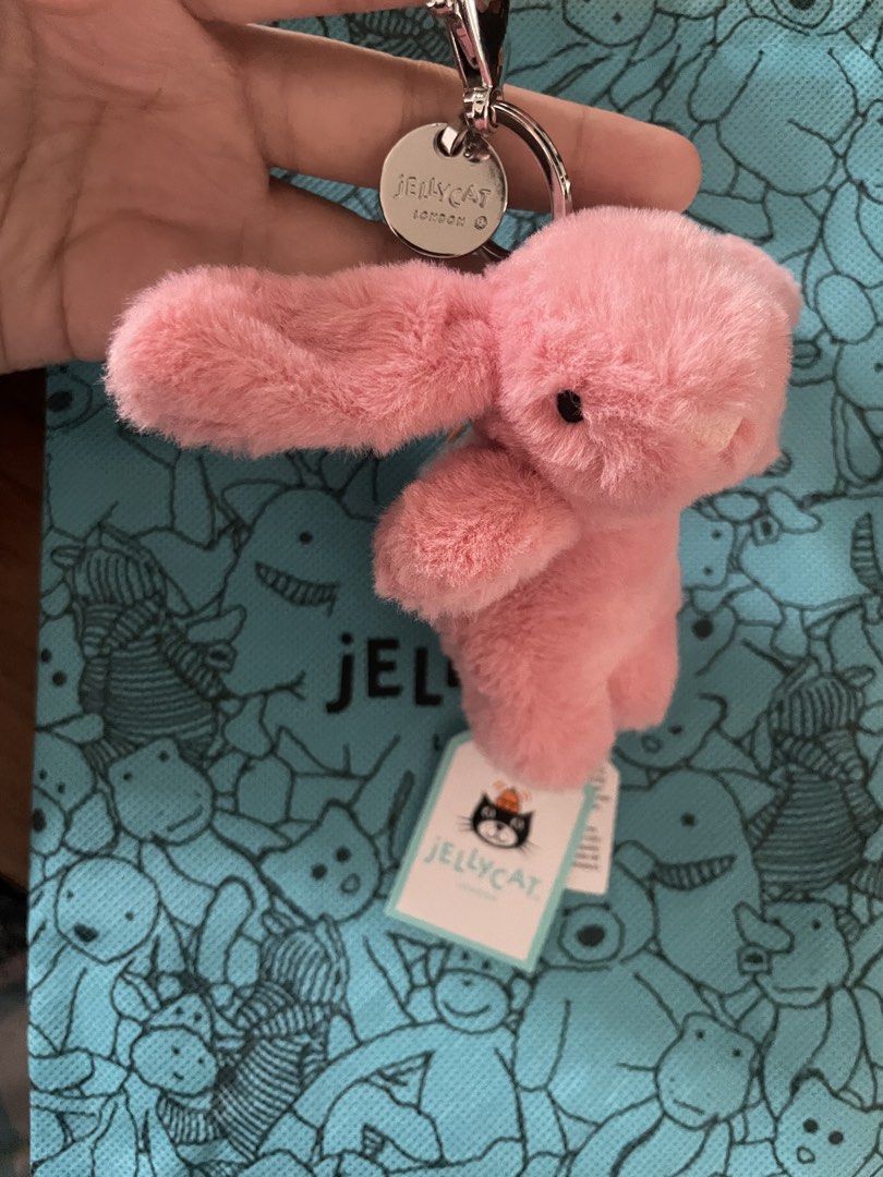 Jellycat Bashful Bunny Pink Bag Charm Keychain (Category: Charms) located in San Juan City. Submitted by nicheprincess (Listing ID 1442580814, Image 3). Description: - Adorable pink bunny keychain from Jellycat. - Made with super soft and fluffy material. - Features original Jellycat tags. - Ideal for attaching to bags, backpacks, or purses. - A wonderful gift for Jellycat enthusiasts. .