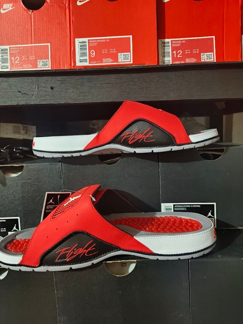 Jordan Flight Red/Black Slides Sandals (Category: Slippers & Slides) located in Manila. Submitted by basiclang (Listing ID 1442696704, Image 3). Description: - Jordan Flight Slides - Color: Red and Black - Size: 10 - Features: Textured footbed for grip, - durable sole with good tread for traction - Ideal for: Casual wear, post-sports recovery - Condition: Brand new with original tags - 3395 size 8,9,10,11.