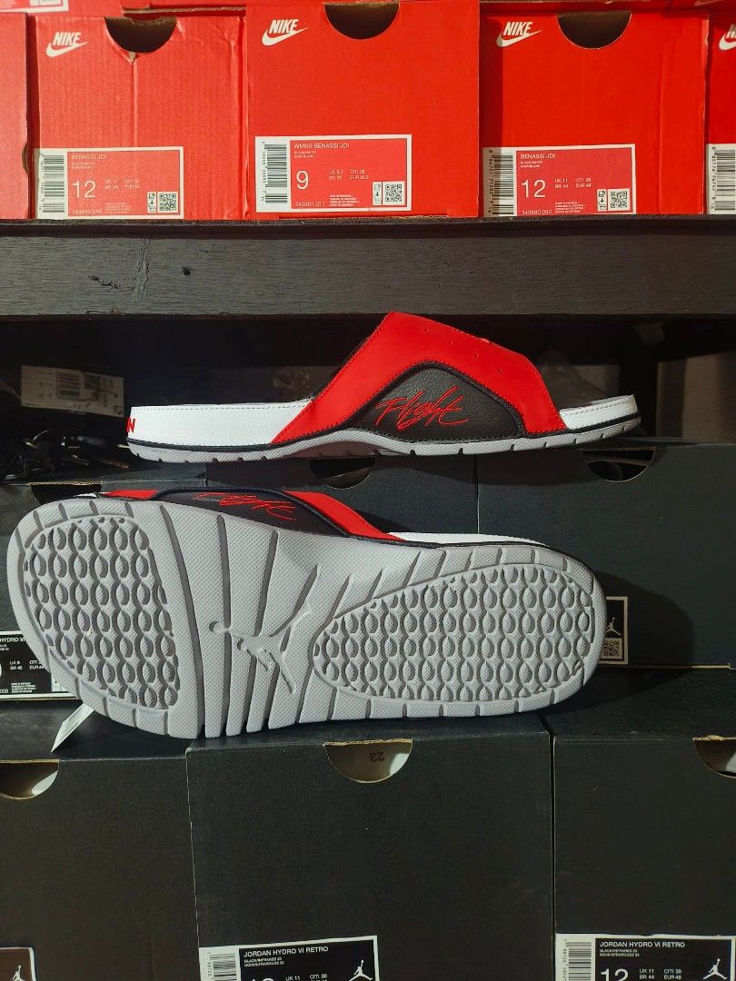 Jordan Flight Red/Black Slides Sandals (Category: Slippers & Slides) located in Manila. Submitted by basiclang (Listing ID 1442696704, Image 2). Description: - Jordan Flight Slides - Color: Red and Black - Size: 10 - Features: Textured footbed for grip, - durable sole with good tread for traction - Ideal for: Casual wear, post-sports recovery - Condition: Brand new with original tags - 3395 size 8,9,10,11.