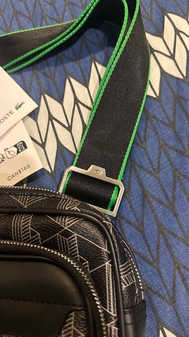Lacoste Monogram Crossbody Bag Black Green Strap (Category: Cross-body Bags) located in Caloocan City. Submitted by krisellean89709 (Listing ID 1442556000, Image 3). Description: - Authentic Lacoste crossbody bag - Color: Black with white geometric monogram print - Adjustable strap with green trim and silver buckle - Multiple zippered compartments for organization - Ideal for everyday use or travel - Brand new with tags.