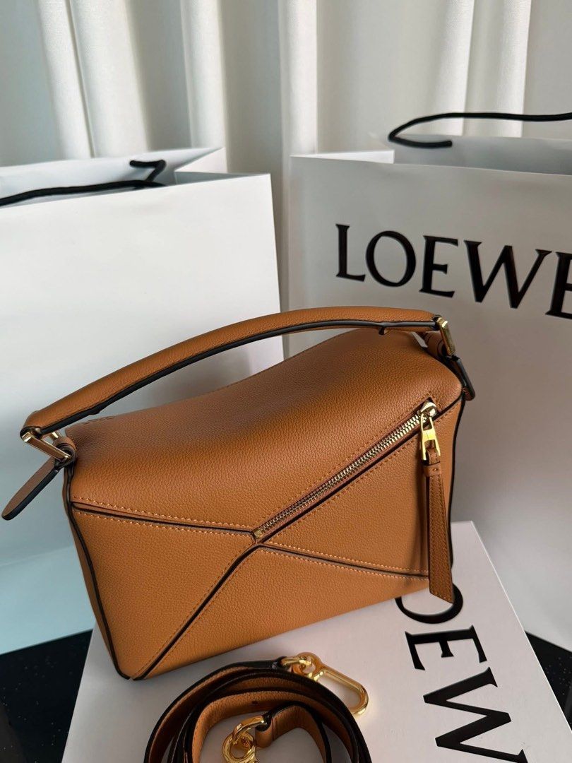 Loewe Puzzle Bag Tan Leather (Category: Luxury Bags & Wallets) located in Pasig City. Submitted by gluxerare (Listing ID 1442555396, Image 2). Description: A must have bag! ❤️ Rush Sale! Super ganda lalo sa personal! 😍.