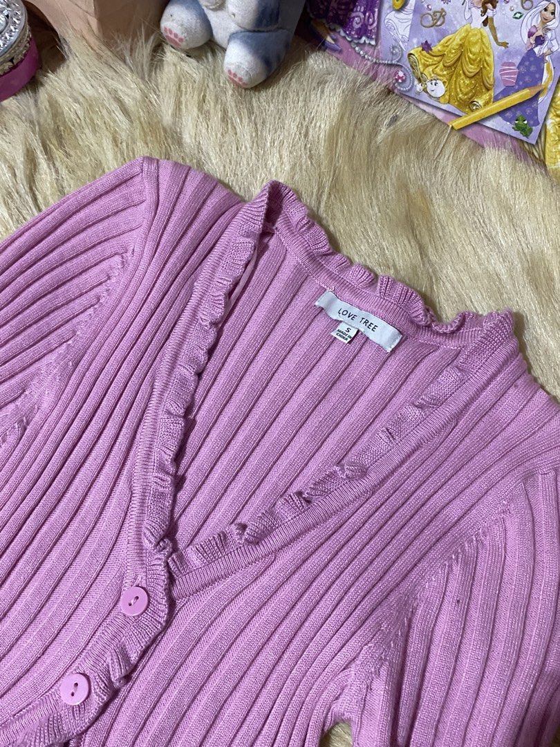 Love Tree Pink Ribbed Button-Up Cardigan (Category: Coats, Jackets and Outerwear) located in Mexico. Submitted by timitum (Listing ID 1442703604, Image 2). Description: - Cute pink ribbed cardigan from Love Tree - Short sleeves with ruffled edges - Button-up front - Ruffled neckline and hem - Easy to style for casual or dressy looks.