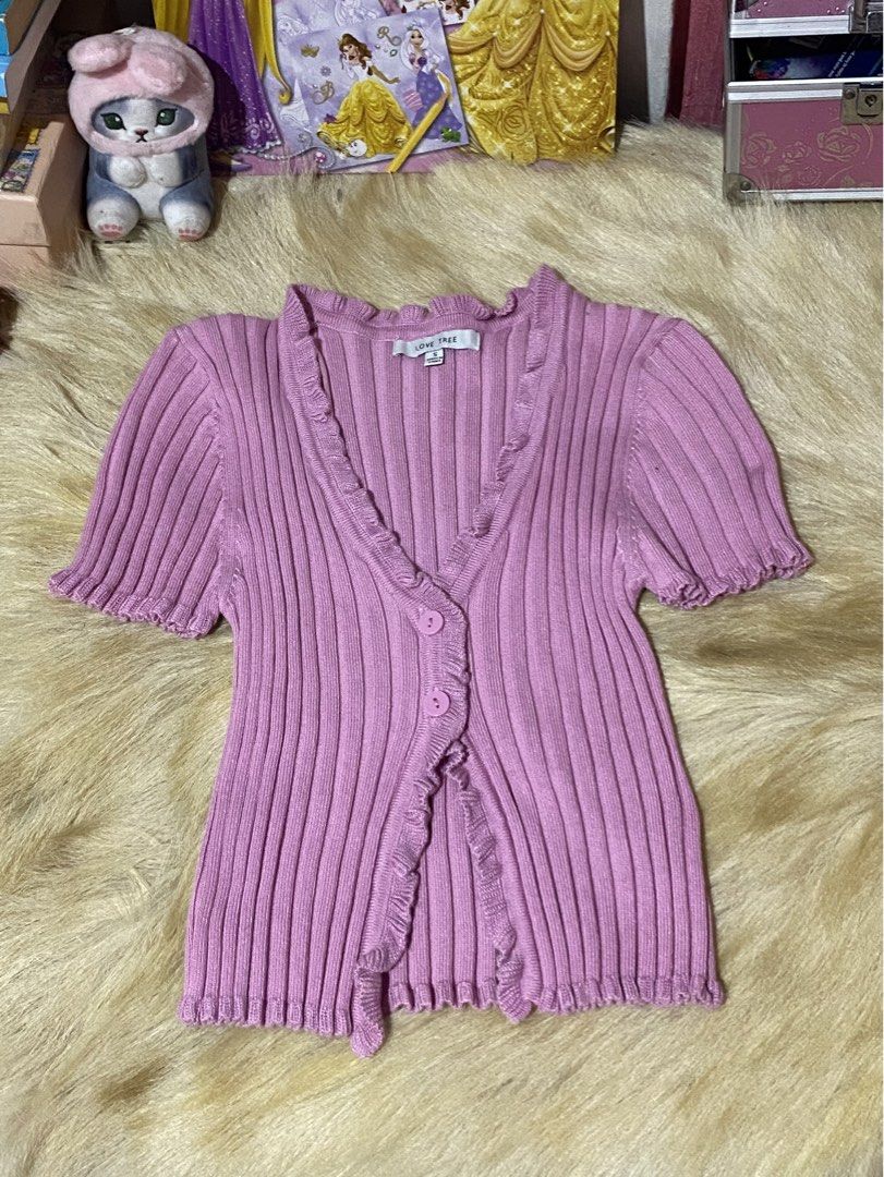 Love Tree Pink Ribbed Button-Up Cardigan (Category: Coats, Jackets and Outerwear) located in Mexico. Submitted by timitum (Listing ID 1442703604, Image 1). Description: - Cute pink ribbed cardigan from Love Tree - Short sleeves with ruffled edges - Button-up front - Ruffled neckline and hem - Easy to style for casual or dressy looks.