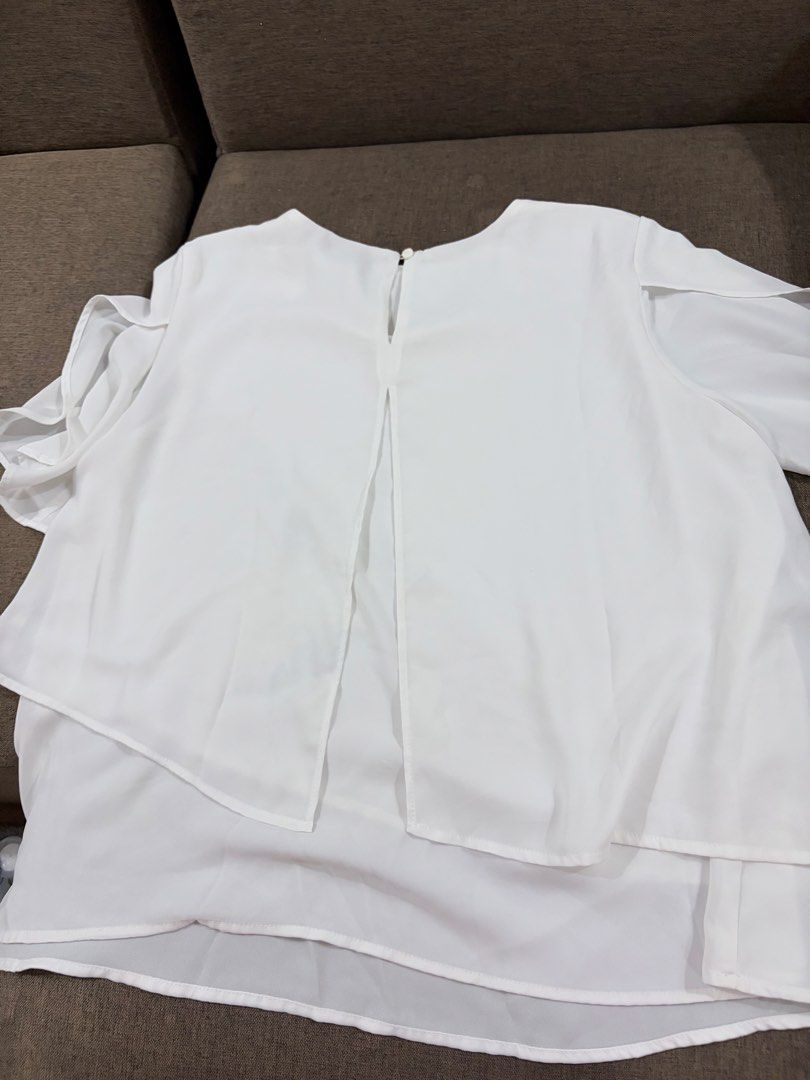 Mango Basics White Layered Chiffon Blouse Size S (Category: Blouses) located in Santa Cruz, Pampanga. Submitted by emgihem (Listing ID 1442620578, Image 3). Description: - White layered chiffon blouse from Mango Basics - Short sleeves - Flowy, asymmetrical hem - Button closure at the back neck - Lightweight and airy material - Versatile for dressing up or down.