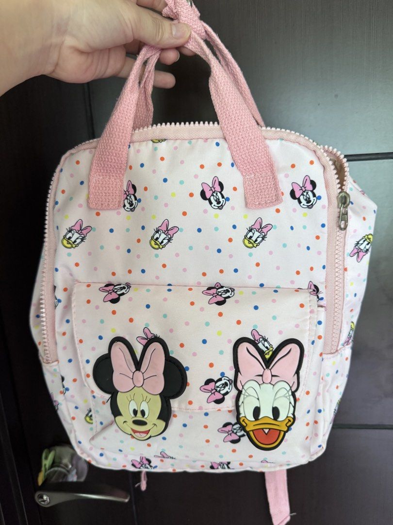 Minnie Mouse Backpacks for kids (small) 0-4 (Category: Backpacks) located in Quezon City. Submitted by amvilaine (Listing ID 1442546945, Image 1). Description: 🎀 Disney Minnie & Daisy Mini Backpack 🎀 Preloved but still in good condition. Cute, lightweight, and perfect for kids or Disney lovers! .