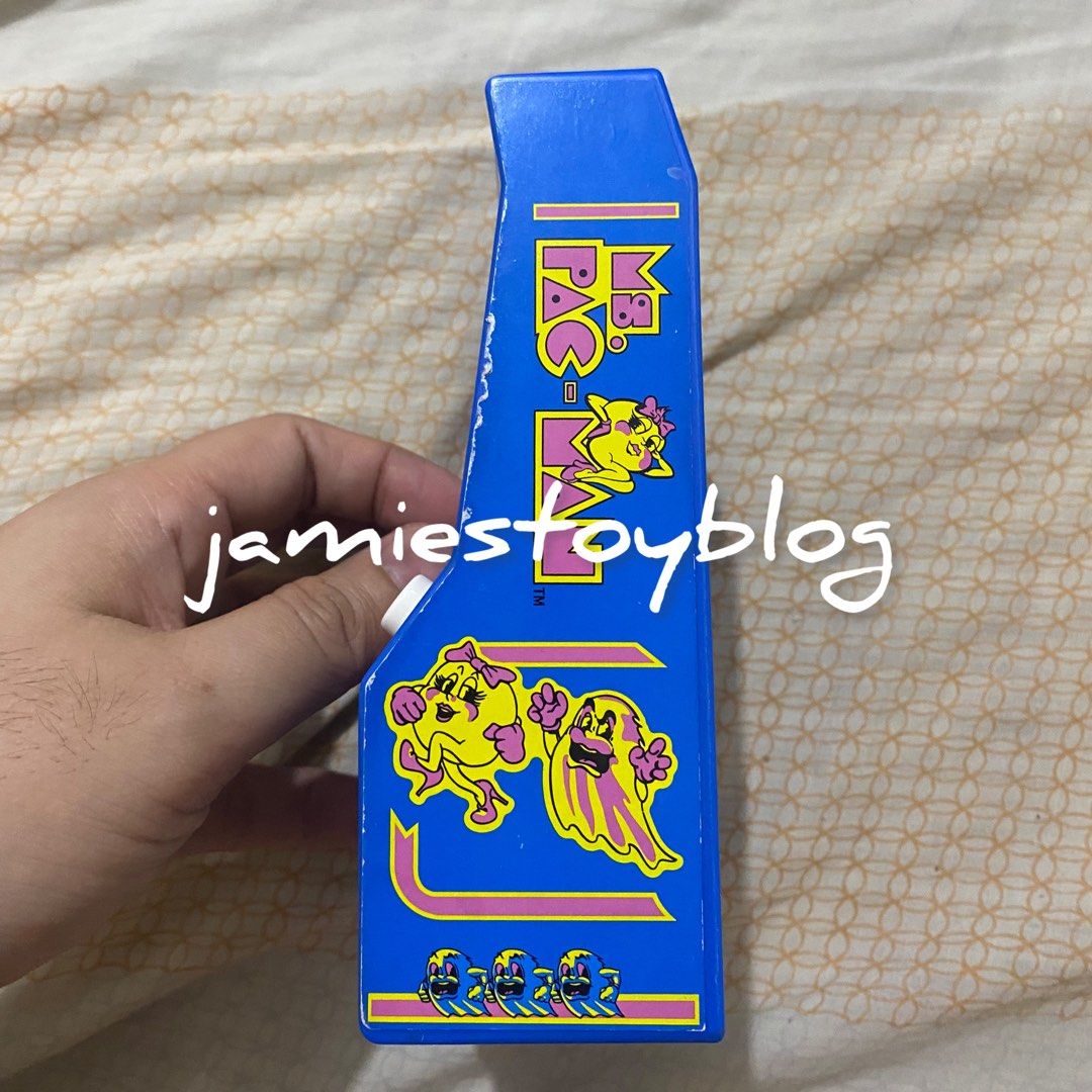 Ms. Pac-Man Mini Handheld Arcade Game (Category: Interactive Toys) located in Quezon City. Submitted by ohitsninja (Listing ID 1442585503, Image 3). Description: - Blue Ms. Pac-Man handheld arcade game - Features classic Ms. Pac-Man gameplay - Includes joystick and buttons for authentic control - Powered by batteries - Ideal for retro gaming enthusiasts - Compact and portable, perfect for travel or quick gaming sessions - Relive your favorite arc