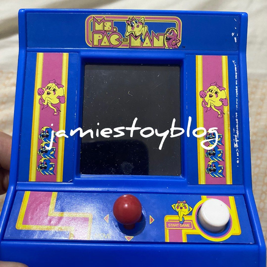 Ms. Pac-Man Mini Handheld Arcade Game (Category: Interactive Toys) located in Quezon City. Submitted by ohitsninja (Listing ID 1442585503, Image 2). Description: - Blue Ms. Pac-Man handheld arcade game - Features classic Ms. Pac-Man gameplay - Includes joystick and buttons for authentic control - Powered by batteries - Ideal for retro gaming enthusiasts - Compact and portable, perfect for travel or quick gaming sessions - Relive your favorite arc