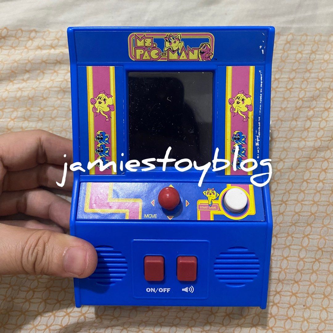 Ms. Pac-Man Mini Handheld Arcade Game (Category: Interactive Toys) located in Quezon City. Submitted by ohitsninja (Listing ID 1442585503, Image 1). Description: - Blue Ms. Pac-Man handheld arcade game - Features classic Ms. Pac-Man gameplay - Includes joystick and buttons for authentic control - Powered by batteries - Ideal for retro gaming enthusiasts - Compact and portable, perfect for travel or quick gaming sessions - Relive your favorite arc