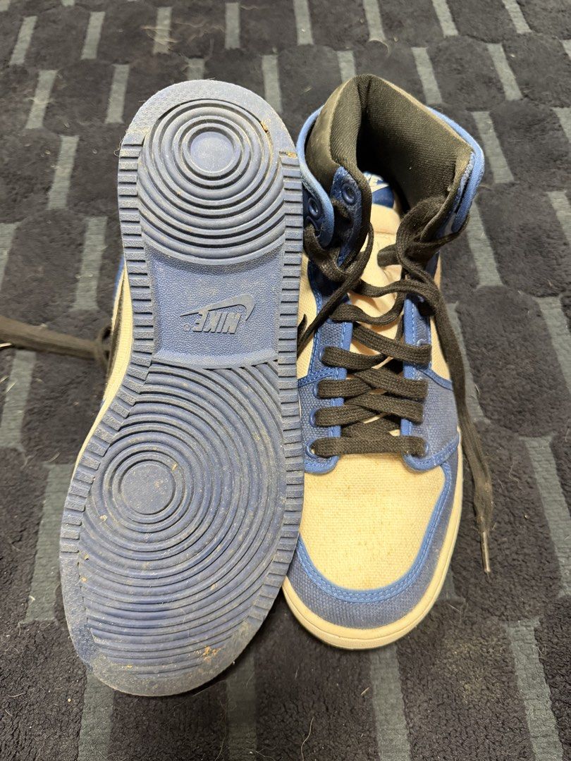 Nike Air Jordan 1 High OG (Category: Sneakers) located in Paranaque City. Submitted by draztiknoize (Listing ID 1442713034, Image 2). Description: - Classic high-top sneaker style - Combination of blue leather and canvas upper - Features black laces and a white sole - Perfect for everyday casual wear - Shows some signs of wear on soles and uppers, but still in good usable condition.