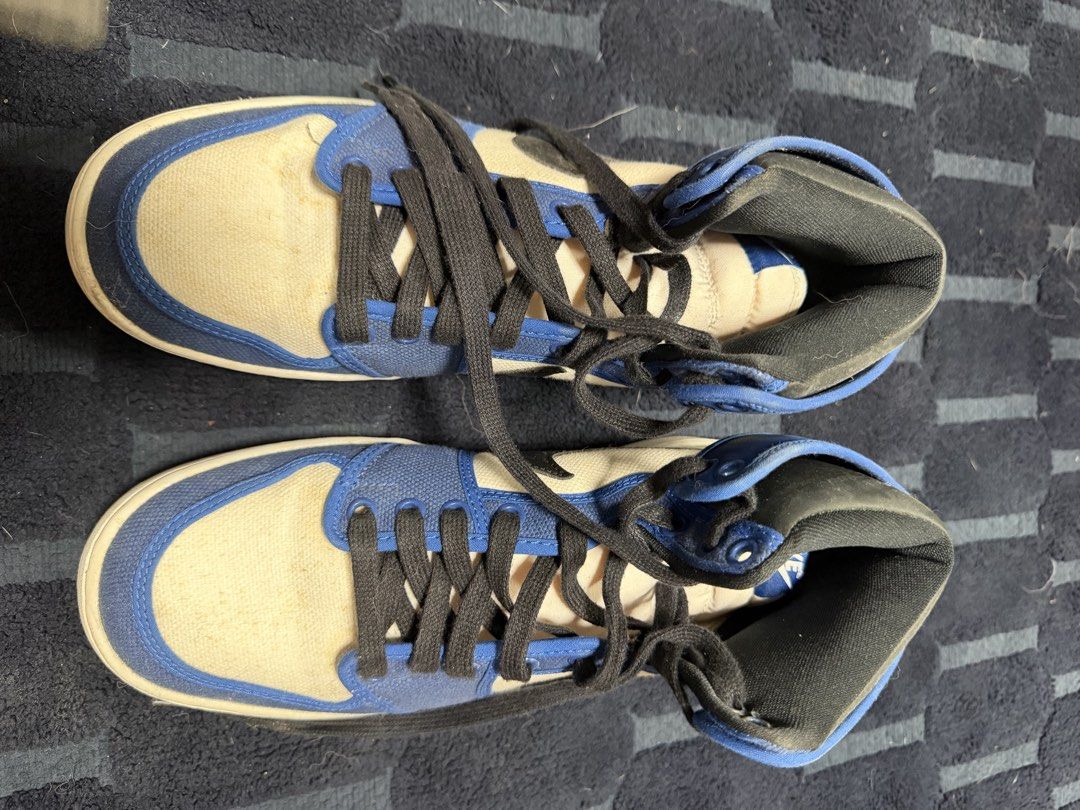 Nike Air Jordan 1 High OG (Category: Sneakers) located in Paranaque City. Submitted by draztiknoize (Listing ID 1442713034, Image 3). Description: - Classic high-top sneaker style - Combination of blue leather and canvas upper - Features black laces and a white sole - Perfect for everyday casual wear - Shows some signs of wear on soles and uppers, but still in good usable condition.