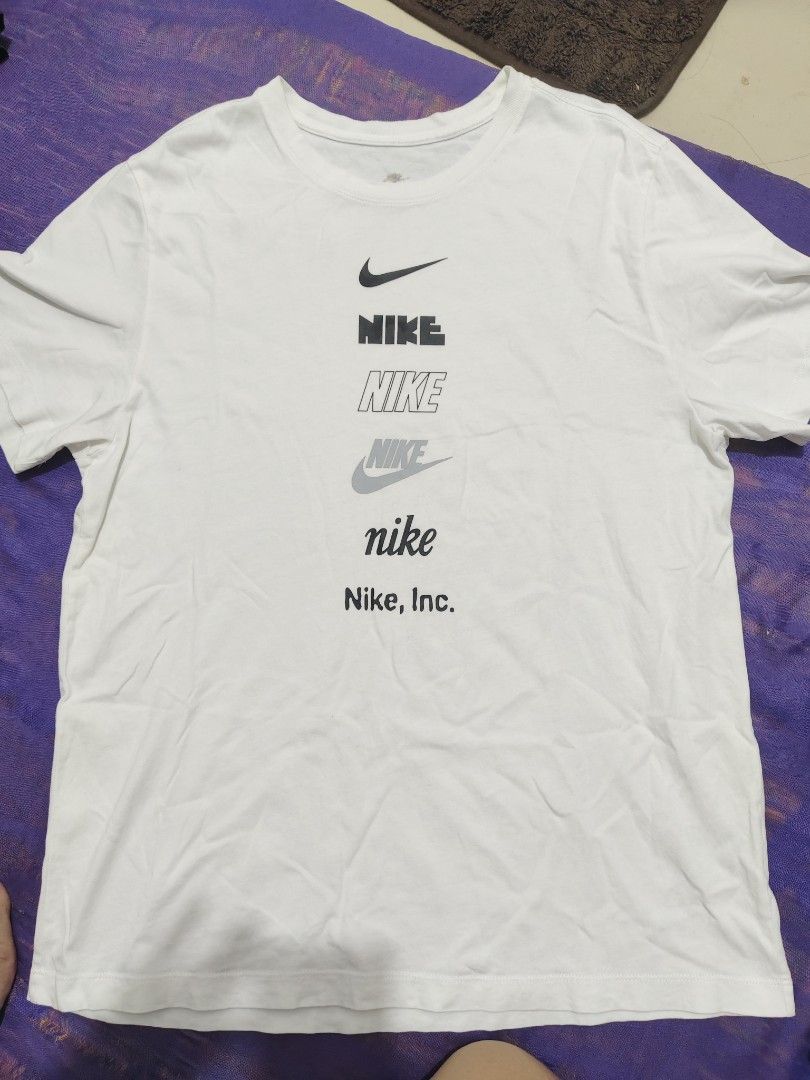 Nike Tee (Category: Tshirts & Polo Shirts ) located in Manila. Submitted by vicious1419 (Listing ID 1442549697, Image 1). Description: - Classic white Nike t-shirt - Features a graphic print on the front with the Nike logo and 'Nike, Inc.' text - Made from soft, comfortable cotton material - Ideal for everyday casual wear - Versatile and easy to pair with any outfit.