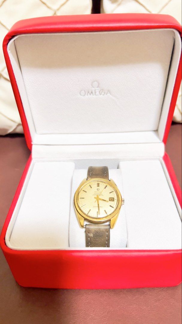 Omega Seamaster Gold Watch with presentation box (Category: Luxury Watches) located in Paranaque City. Submitted by vanillag0815 (Listing ID 1442633494, Image 3). Description: - Authentic 1960’s -70’s Omega Seamaster timepiece - Elegant gold tone case and dial - Date window at 3 o'clock - Comes with Omega presentation box, outer box, and booklet - Classic leather butterfly strap - 36mm - caliber 564 -original Omega Crown -Champagne Dial pls set y