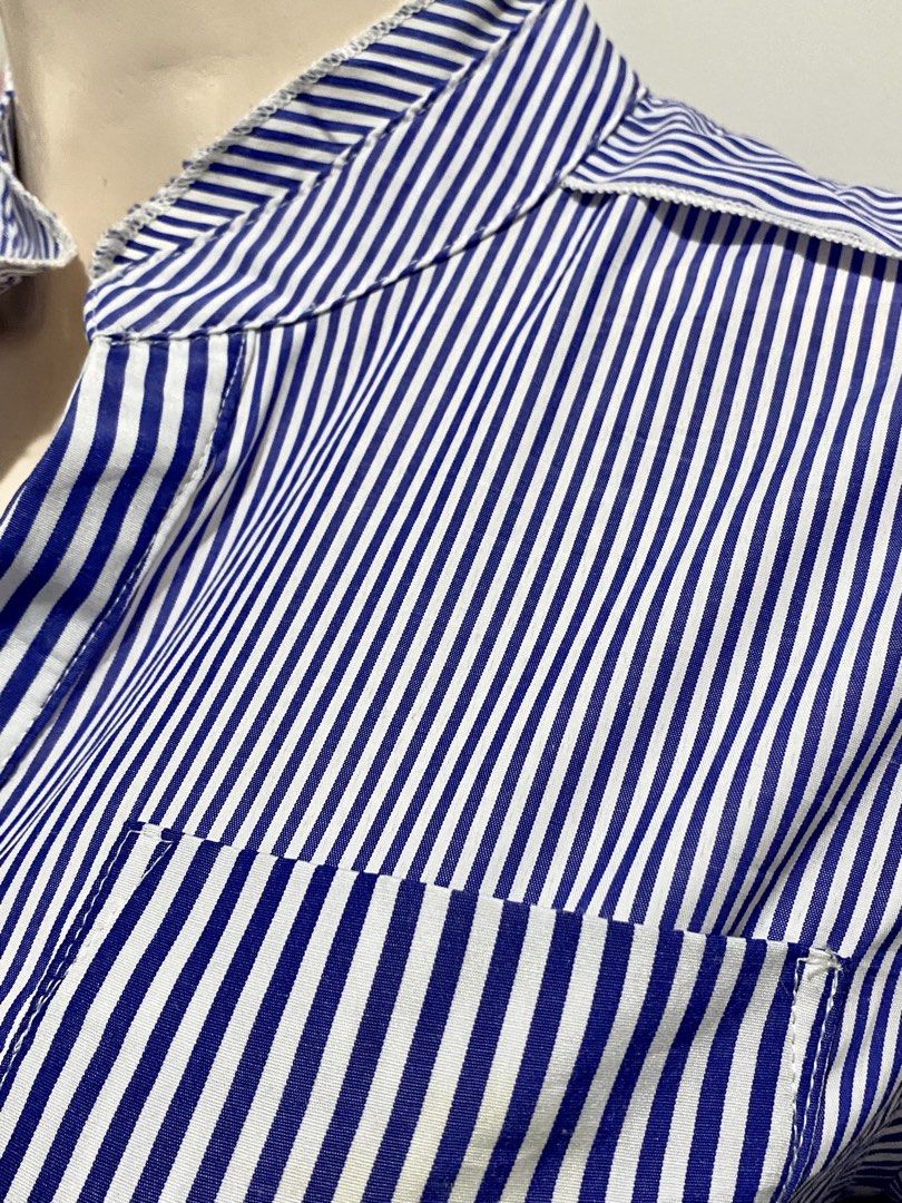 Ovia blue stripe Dress (Category: Dresses) located in Binan City. Submitted by myutopia28 (Listing ID 1442624613, Image 3). Description: Size small to medium Model: OviaPattern: Blue and white vertical pinstripesDesign Features:Classic point collar with a full button-down front placketFitted, gathered elasticized waist panel for structured tailoringAsymmetric stripe orientation on the chest pocket and bottom skirt trimLong sleeves with structured